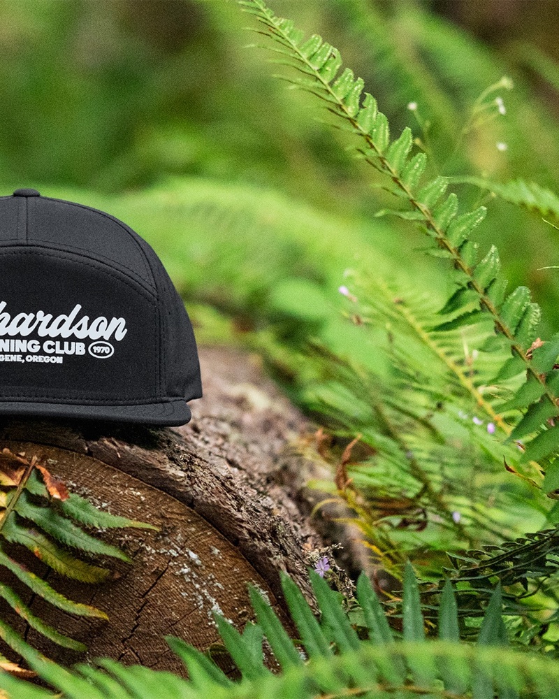 Slide 7: Running Club cap among ferns, right half